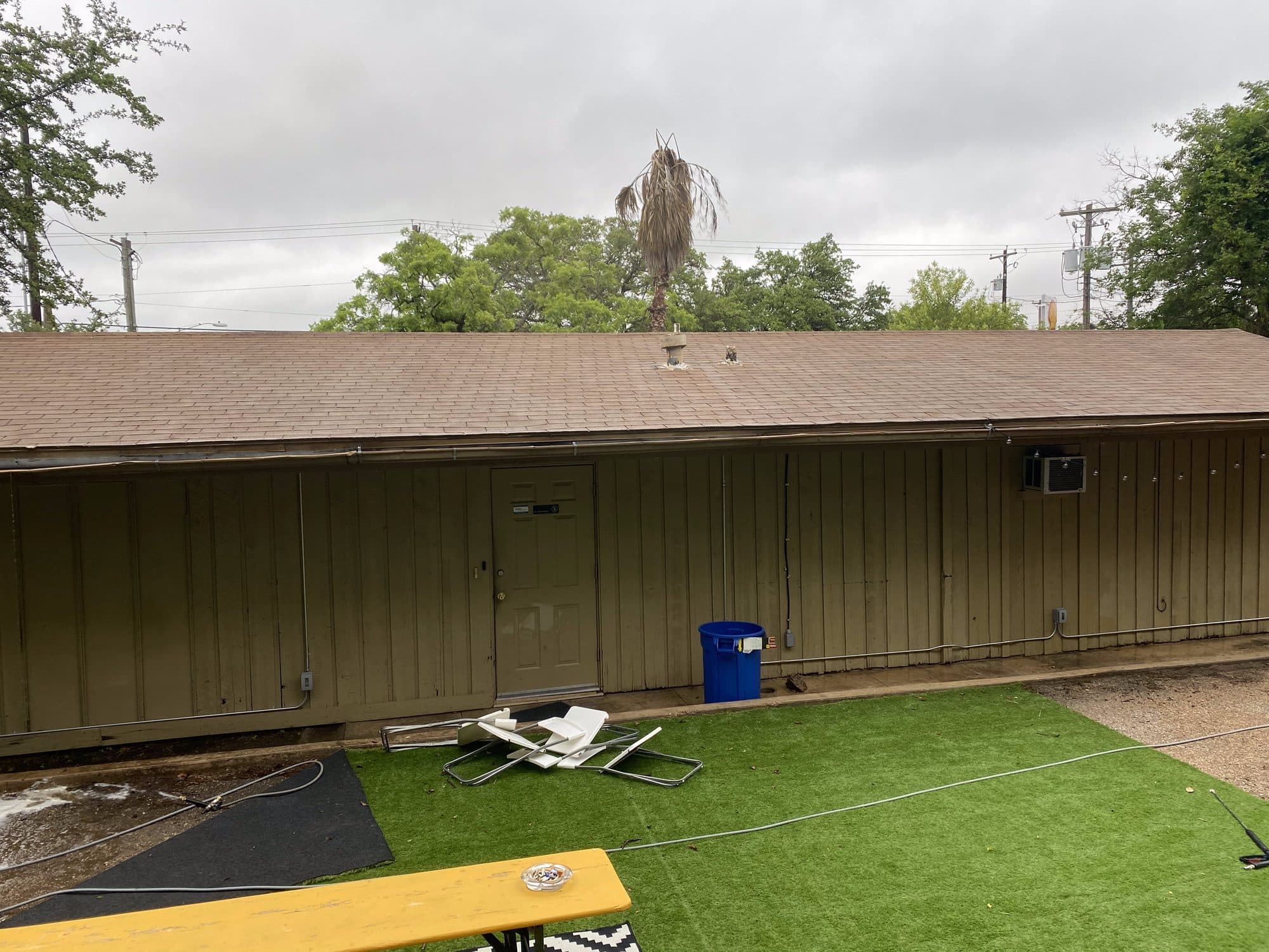 Building exterior after roof and siding wash with clean appearance