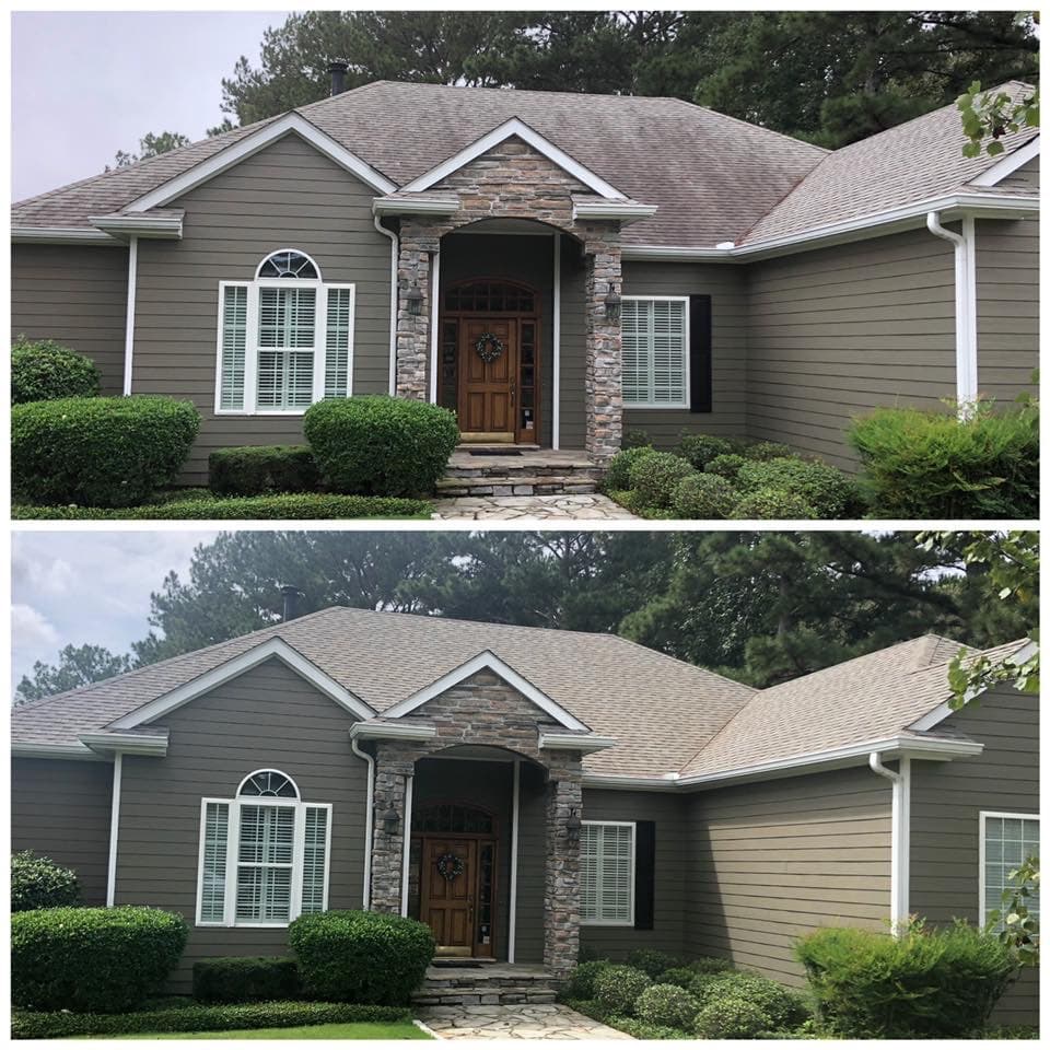Upscale stone front home before and after roof cleaning